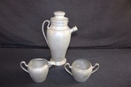 Pewter Entertaining Lot: all marked with logo of Royal Solid Pewter M.M. Co. Martini shaker 10.75" tall and cream (3.5" high) and sugar (3" high); dented in 3 places and creamer needs a little reshaping,which is quite easy ... sit piece(s) out in the sun and pewter becomes very pliable.