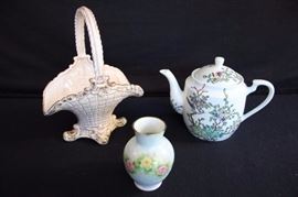 Porcelain & Ceramic Collection: 1 quart teapot (6") with oriental floral and bird design marked with logo for Japanese Porcelain Ware Decorated in Hong Kong A.C.E., small porcelain hand painted vase (4") marked 8-20-1985 Bavaria Western Germany signed by Dorothy . . .; ceramic basket (9") light pink trimmed with marked Flora line by Florence Ceramics Inc, Pasadena, California Copyright R-15.  All This lot is in very good condition and shows little wear, if any - no chips or cracks
