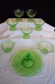 8-Piece Green Depression Glass: 9" Spiral Green round platter w/ handle for cookie/appetizer cookie/appetizers; cream & sugar set: by Hazel Atlas in the Florentine #2 pattern creamer 3" diameter, 3.5" high and sugar bowl 4.5" diameter, 2.75" high set; two one-scoop ice cream dishes, 3.5" diameter, 3.5" high;  three one-scoop ice cream dishes 3.5+"  diameter, 3" high. This lot is in very good condition and shows little wear, if any - no chips or cracks
