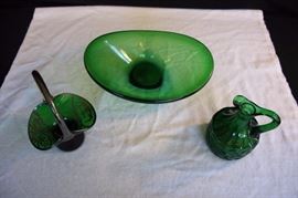 Deep Forest Green Lot: oval bowl or decorator piece, 10.5" x 7.75"; cruet with swirl design 5.25" tall x 3.5" wide; and mini small basket piece decorated with floral and Asian sterling silver overlay and handle, stands 7" high, 4.75" long, 3.75" wide. This lot is in very good condition and shows little wear, if any - no chips or cracks.