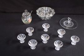 Vintage Clear Glass Lot: 5: hand painted jelly jar with lid and glass spoon;  8 pedestal salt cellars, 2.5" diameter, 2" tall; small tid-bit serving plate with handles 7" diameter; round covered bowl 7" diameter, stands 4.5". This lot is in very good condition and shows little wear, if any - no chips or cracks.