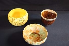 California Pottery Planters: 1950-60's - 8" round multi-drip bowl with pedestal 2.5" high; 6" brown drip planter, 5" high marked MB2 Judy USA; 8" yellow with brown and orange splatter print marked USA #96, 4.5" high. All in very good usable condition, no chips or cracks.