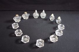 Clear Salt & Pepper Shakers & Salt Cellar: 2.25" round S&P with plastic lids, marked Irice NY; 2.75" swirled  S&P with metal lids, marked Irice; 2.5"  diamond shaped with sterling silver and mother of pearl lids (small chip on base of salt); 7 salt cellars 2.5" diameter. This lot is in very good condition and shows little wear, if any - no chips or cracks.