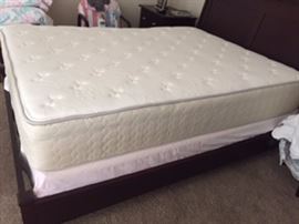 Queen Sleigh Bed Frame low profile with Sealy Posturpedic Signature Hidden Meadow Mattress and Box Spring.   Beautiful dark stained wood frame. This set is in excellent condition - like new.  No stains on mattress, no depressions.