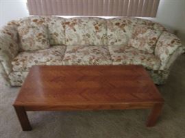 Sofa in tans and browns with chevron wood designed Coffee Table