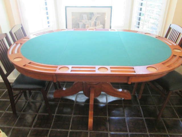 Combination Poker and Dining Room Table.  Can go from oval to round with 1-leaf removal.  Top flips!