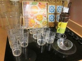 Colorful trivets and mugs.