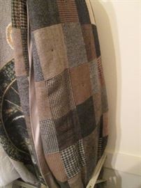 Throw fabricated out of Men's old suit fabrics.  Colors are grays, browns, tweeds, blacks, camels and a full range of neutrals.  Quite unusual!