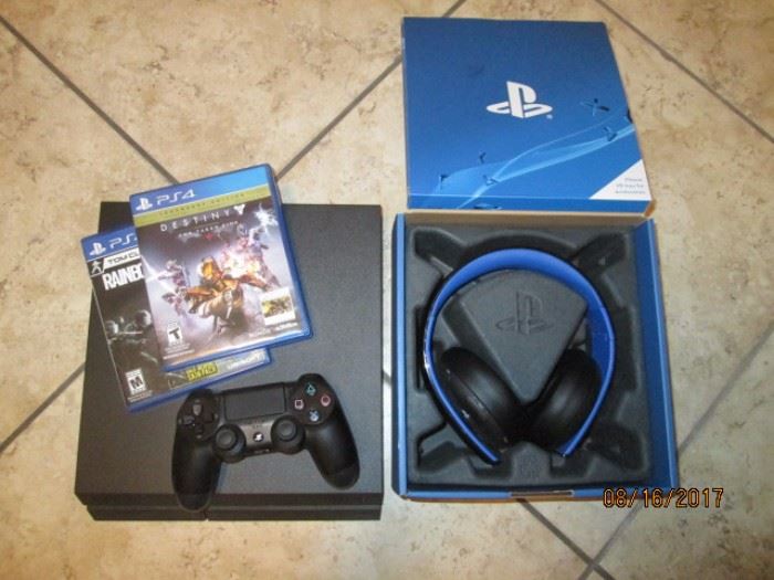 PS4 with headphones and 2 games