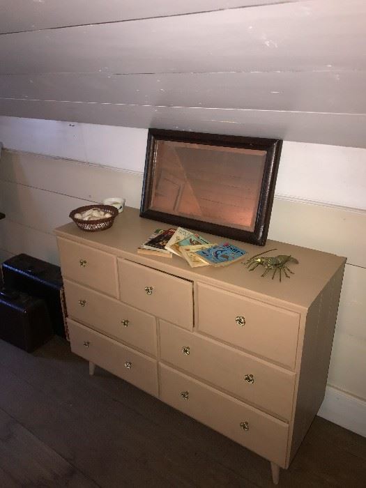 Mid century dresser with seashells, brass lobster, and ocean and seashell books. Beach house/cottage ready