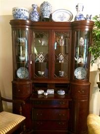 Gorgeous Mahogany secretary with bow front cabinetry, packed with iconic Blue and White
