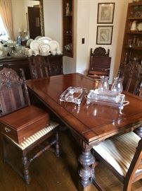This pristine vintage expandable table can be purchased alone, or as part of a set that includes the buffet, five side chairs, one captain's chair, and a hutch. It is all in nearly new condition.
