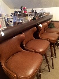 Four nail head accented swivel mid-century bar stools in phenomenal condition