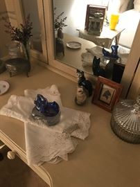 Items arranged on the vanity from linenesmto mercury glass