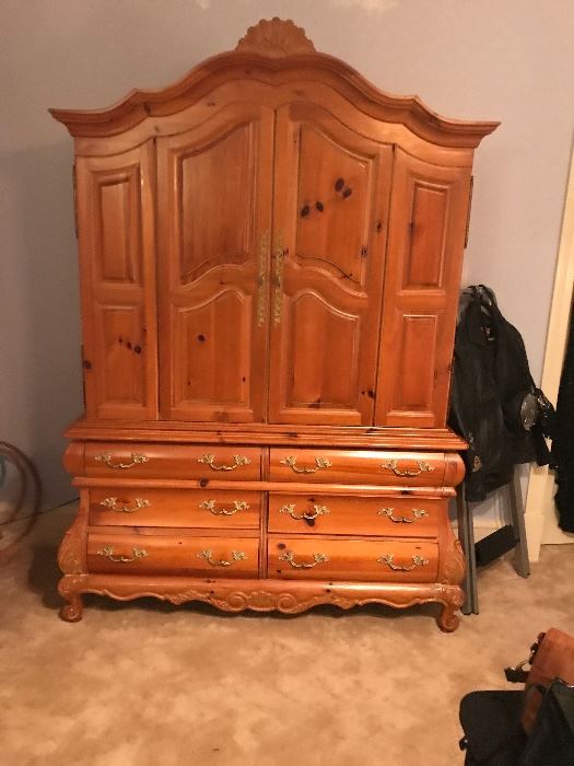 A pretty fabulous large armoire pine with a bombe style. Best bottom. Loads of storage