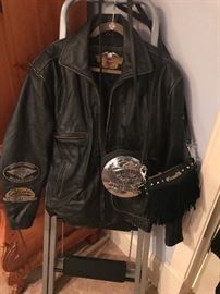 Harley Davidson jacket. Two Harley Davidson purses on the side