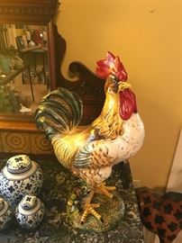 large rooster with a commanding stare overlooks the bedroom