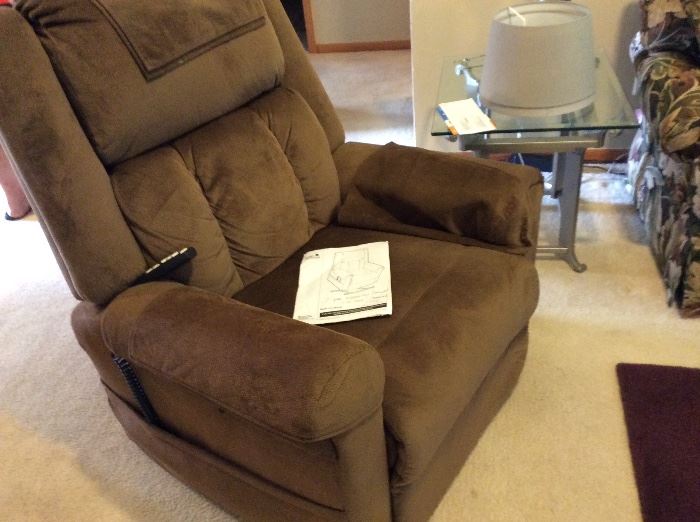 LIKE NEW ELECTRIC RECLINER. IT STANDS, MASSAGES AND HEATS! BOUGHT FOR $1600 AND STILL HAS WARRANTY 