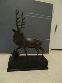deer statue on base