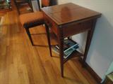 wonderful writing table with inlay, the top opens to a felt surface. the supporting arms can be pulled out from either side to sturdy the top.