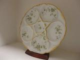 a delicate hand painted oyster plate in excellent condition