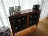 this great piece is thin and so nice in an entry hall- wire doors and great looking wood