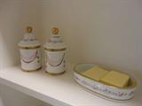 hand painted powder room accessories in the foyer bathroom