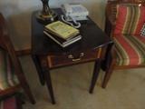 a gorgeous drop side table with inlay in the bedroom