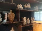 the netsuke that is old and great looking in the living room along with snuff bottles