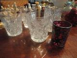 cut glass shot glasses with a red glass and sterling shot glass