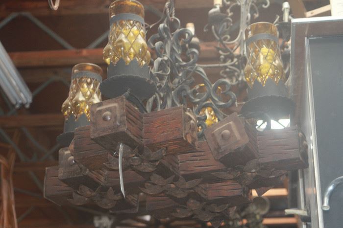Antique wrought iron chandelier with amber glass globes