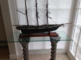 Glass topped sofa table and ship model