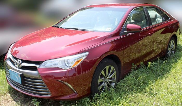 2015 Toyota Camry XLE Sedan with 13,104 Miles; Red Exterior, Light-Gray Leather Interior; Power Locks, Windows, Mirrors, Seats; Heated Front Seats; Remote Keyless Entry Fob; Antilock Brakes; Traction Control; AM/FM Stereo with CD; In-Dash Navigation/Display Screen; Steering Wheel Audio & Other Controls; Hands-free Phone Connectivity with Voice Recognition, and more. VIN: 4T1BF1FK3FU876144