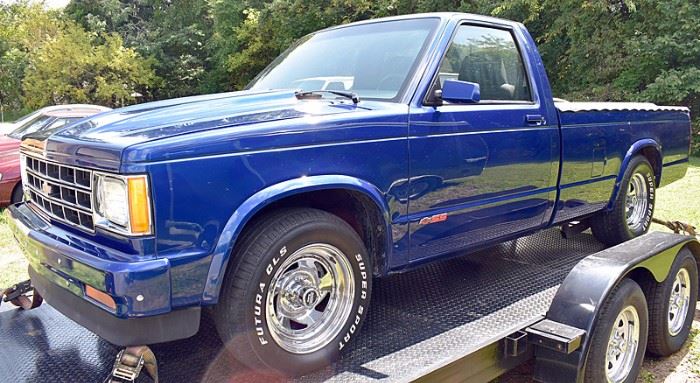 At 8PM: 1983 Chevy S10 Pickup Truck. FULLY REBUILT with 350 Engine; Metallic-Blue Exterior with Ghost Flames; Gray Sport Cloth Interior; Automatic Transmission; Power Steering & Brakes; Dual Exhaust, and more.