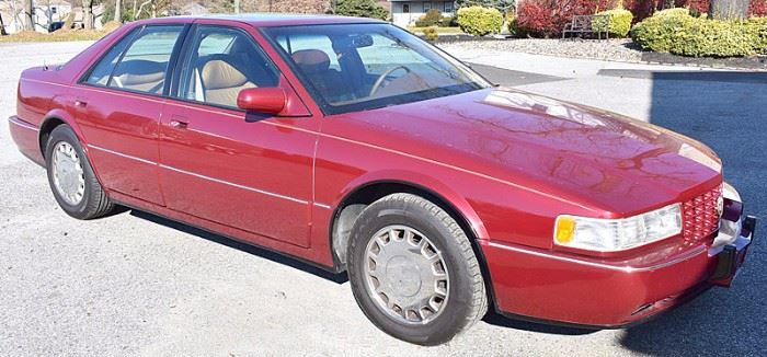 At 8PM: 1994 Cadillac Seville STS with 32V NorthStar Engine; Red Metallic Exterior, with Brown Leather Interior; Power Windows, Locks, Mirrors, Seats; Heated Front Seats; Power Moonroof; Remote Keyless Entry; AM/FM Stereo with CD and Cassette; ABS; In-car Telephone; New Tires; New Battery; Garage Kept and Showroom clean!; Odometer: 24,744. VIN: 1G6KY5297RU839128.