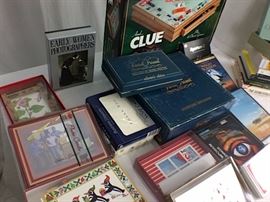 Cards for all occasions, 2 white shades, 2 cream shades, Monopoly & Clue wood game cabinet, Books, Trivial Pursuit and nature DVD's.