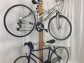Woman's Cannondale 8 speed, 35" seat to floor. Men's Bianchi 37" seat to floor. Custom stand included.