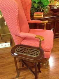 Upholstered chair with small brass accent side table 