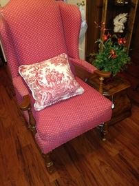 Colorful arm chair and toile pillow