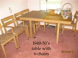 1950's blond table with leaves and six chairs.