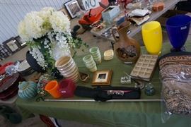 Floral arrangement, decorative items , child's music stand/case, wall tapestry from Biltmore estate, vases.