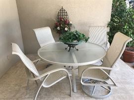 Table and chair set is like NEW! 2 chairs are rockers that swivel.