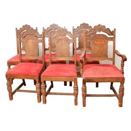 Set of Six of Vintage Dining Room Chairs: A set of six vintage Jacobean style dining chairs. The set includes five side chairs and one armchair. The seats are covered in a red fabric.