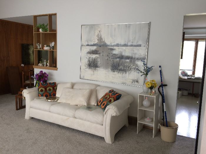 White upholstered sofa and large contemporary framed art