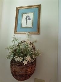 basket with floral and framed print wall decor