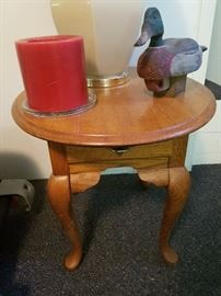 wood accent table, duck decoy decor, candle