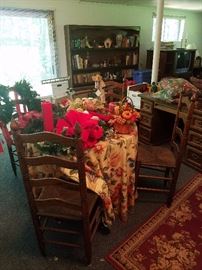 Wood Table (under tablecloth) with four ladder back chairs