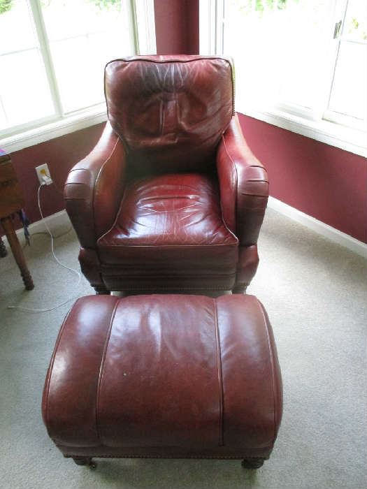 LEATHER BURGUNDY CHAIR AND OTTOMAN, ONE OF TWO