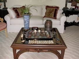 Carved Vintage Coffee Table with smoked glass top, many accessories for sale as can be seen on table