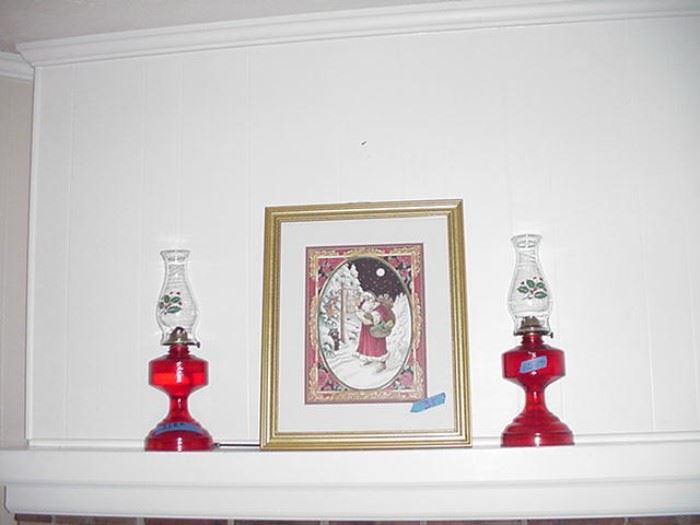 Christmas print; oil lamps with red bases and Christmas holly decorated hurricanes